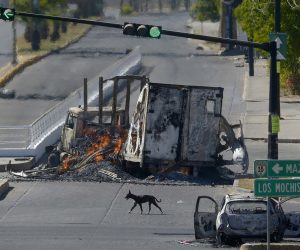 epa10391497 Burned-out vehicles after clashes between federal forces and armed groups following the capture of Ovidio Guzman, an alleged drug trafficker and the son of 'Chapo' Guzman, in the city of Culiacan, state of Sinaloa, Mexico, 05 January 2023.  In the midst of strong security Guzman was transferred to the same prison where his father had previously escaped. As part of a security strategy and in order to not make the information public, the Mexican authorities first sent a convoy of eight vehicles that left around 5:30 p.m. (23:30 GMT) from the Specialized Prosecutor for Organized Crime (Femdo) building in Mexico City and after 6:00 p.m. (00:15 GMT) a helicopter departed from the same place.  EPA/Juan Carlos Cruz