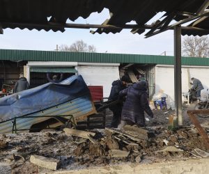epa10397019 Ukrainians attempt to salvage goods at a damaged local market after shelling hit the town of Shevchenkove, Kharkiv region, northeastern Ukraine, 09 January 2023, amid Russia's invasion. Two people were killed and five others injured, among them a child, as a result of a rocket attack on Shevchenkive village in the Kupyansk district, the head of Kharkiv Regional State Administration Oleh Synehubov wrote on telegram. Russian troops on 24 February 2022, entered Ukrainian territory, starting a conflict that has provoked destruction and a humanitarian crisis.  EPA/SERGEY KOZLOV