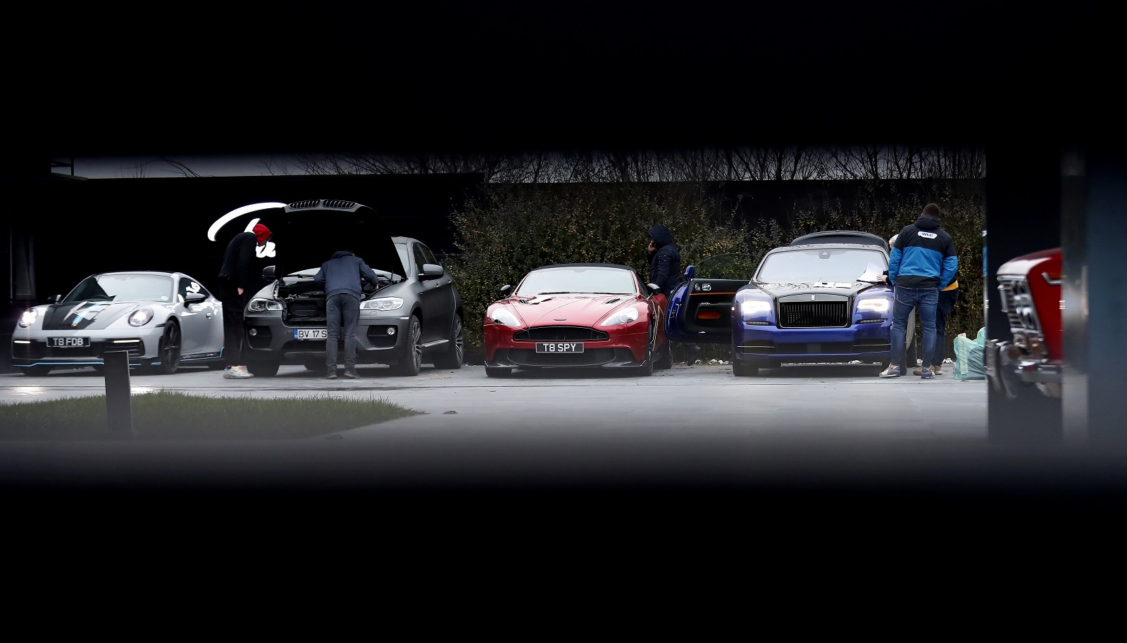 epa10404910 Luxury cars of former professional kickboxer and social media influencer, American-British businessman Andrew Tate, are checked before being confiscated and taken away from his property by Romanian law enforcement officers in Voluntari village, near Bucharest, Romania, 14 January 2023. On 29 December 2022, Andrew and his brother Tristan were arrested as a result of the Directorate for Investigating Organized Crime and Terrorism (DIICOT) inquiry under the charges of human trafficking and intention to form an organized crime group. Romanian police stated that the two brothers and their associates coerced victims for creating a paid pornography service for social media platforms. A Romanian judge ordered, on 30 December 2022, that Andrew Tate shall remain in police custody for 30 days, as a criminal police investigation is ongoing. In total, 11 cars and 10 buildings located near Bucharest, or in Ilfov and Prahova counties, owned by the Tate brothers, were seized by the Romanian authorities until the inquiry will be finished.  EPA/Robert Ghement