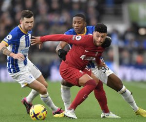 epa10405150 Liverpool's Alex Oxlade-Chamberlain (front) in action against Brighton's Pervis Estupinan (back) during the English Premier League soccer match between Brighton and Hove Albion and Liverpool FC in Brighton, Britain, 14 January 2023.  EPA/Vince Mignott EDITORIAL USE ONLY. No use with unauthorized audio, video, data, fixture lists, club/league logos or 'live' services. Online in-match use limited to 120 images, no video emulation. No use in betting, games or single club/league/player publications