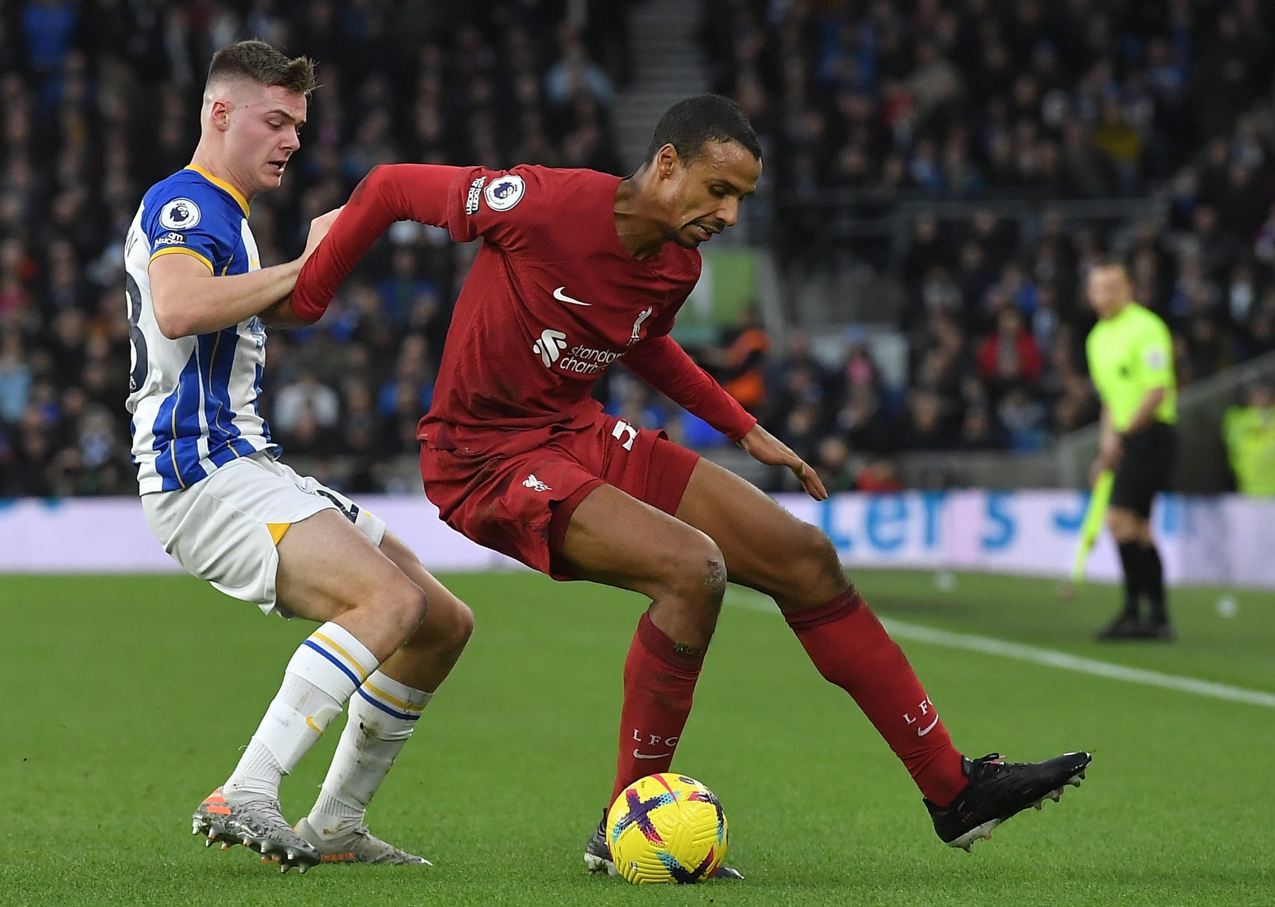 epa10405181 Liverpool's Joel Matip (R) in action against Brighton's Evan Ferguson (L) during the English Premier League soccer match between Brighton and Hove Albion and Liverpool FC in Brighton, Britain, 14 January 2023.  EPA/Vince Mignott EDITORIAL USE ONLY. No use with unauthorized audio, video, data, fixture lists, club/league logos or 'live' services. Online in-match use limited to 120 images, no video emulation. No use in betting, games or single club/league/player publications
