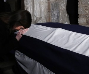 epa10408350 A woman pays her respects to the former King Constantine II, at Saint Eleftherios chapel of the Metropolis Ctahedral in Athens, Greece, 16 January 2023. Greece's former King Constantine II died at the age of 82 on 10 January 2023. The funeral service is due to take place at the Metropolis Cathedral of Athen and he will be burried near the graves of his ancestrors at the Tatoi former royal palace.  EPA/YANNIS KOLESIDID