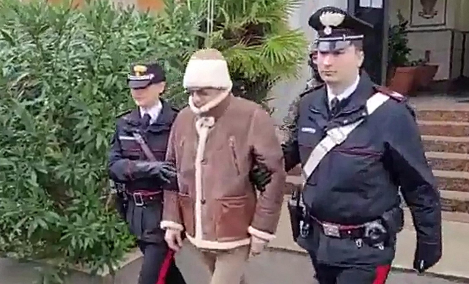 epa10408655 A handout still taken from footage made available by Italy's Carabinieri shows Mafia boss Matteo Messina Denaro, Italy's most wanted man, being arrested in Palermo, Sicily, by the Carabinieri police's ROS unit after 30 years on the run, 16 January 2023.  EPA/CARABINIERI HANDOUT  HANDOUT EDITORIAL USE ONLY/NO SALES HANDOUT EDITORIAL USE ONLY/NO SALES