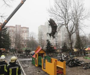 epa10413087 Rescue services remove debris of the helicopter at the scene of a helicopter crash in Brovary, near Kyiv, Ukraine, 18 January 2023. At least 18 people died, including three children, after a helicopter crashed near a kindergarten and a residential building in the city of Brovary, Oleksiy Kuleba, the head of Kyiv Regional Military Administration wrote on telegram. 'Among them are Minister of Internal Affairs of Ukraine Denys Monastyrskyi, his first deputy Yevhen Yenin, State Secretary of the Ministry of Internal Affairs Yuri Lubkovych, their assistants and the helicopter crew.', stated President of Ukraine Volodymyr Zelensky.  EPA/SERGEY DOLZHENKO