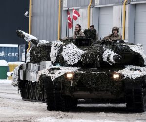 epa10416324 Danish Army serviceman with their main battle tanks Leopard 2 during the Ukraine Military Aid Meeting in Tapa military camp, Estonia, 19 January 2023. British Defense minister attended a meeting on Ukraine military aid at the Tapa Military Camp in Estonia, ahead of the Ramstein format meeting, an international meeting of donors providing military aid to Ukraine took place, where Estonia, the United Kingdom, and several other countries presented their newest aid packages. At an international meeting called together on the initiative of Estonia and the United Kingdom, participating states presented their newest military aid packages for Ukraine, which also include a significant amount of heavy weapons.  EPA/VALDA KALNINA