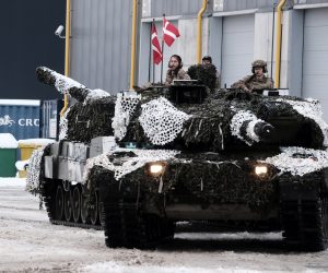epa10416324 Danish Army serviceman with their main battle tanks Leopard 2 during the Ukraine Military Aid Meeting in Tapa military camp, Estonia, 19 January 2023. British Defense minister attended a meeting on Ukraine military aid at the Tapa Military Camp in Estonia, ahead of the Ramstein format meeting, an international meeting of donors providing military aid to Ukraine took place, where Estonia, the United Kingdom, and several other countries presented their newest aid packages. At an international meeting called together on the initiative of Estonia and the United Kingdom, participating states presented their newest military aid packages for Ukraine, which also include a significant amount of heavy weapons.  EPA/VALDA KALNINA