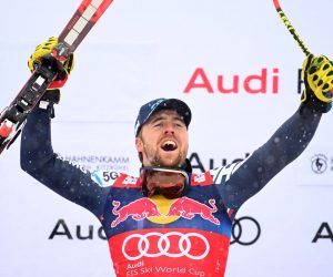epa10420361 Winner Aleksander Aamodt Kilde of Norway celebrates on the podium for the Men's Downhill race of the FIS Alpine Skiing World Cup at the Streif ski course in Kitzbuehel, Austria, 21 January 2023.  EPA/CHRISTIAN BRUNA