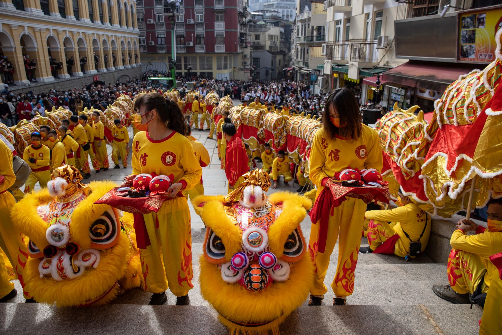 epa10421883 Worshippers prepare for a dragon dance to celebrate the Chinese lunar new year in Macau, China, 22 January 2023. Macau borders reopened earlier this month and the city has launched a promotional campaign to boost tourism, offering Hong Kong residents a 'half-price' round-trip if travellers spend a night there during the Chinese Lunar New Year period. The Chinese lunar new year, also called 'Spring Festival', falls on 22 January 2023, marking the beginning of the Year of the Rabbit.  EPA/JEROME FAVRE