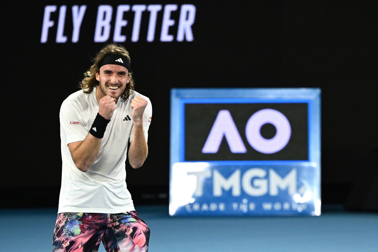 epa10422548 Stefanos Tsitsipas of Greece celebrates after winning his 4th round match against Jannik Sinner of Italy at the 2023 Australian Open tennis tournament in Melbourne, Australia, 22 January 2023.  EPA/JOEL CARRETT  AUSTRALIA AND NEW ZEALAND OUT
