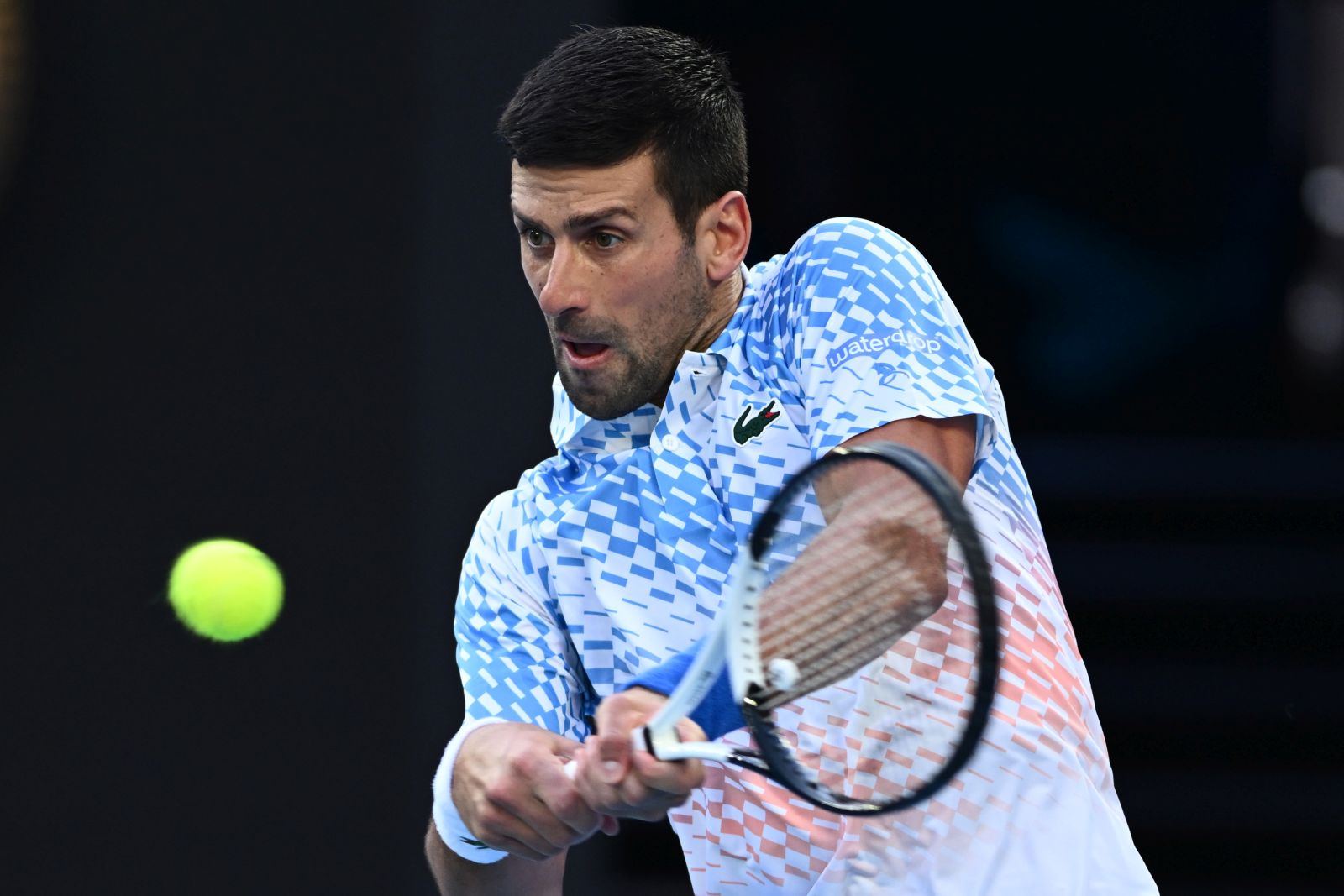 epa10424349 Novak Djokovic of Serbia in action during his match against Alex de Minaur of Australia at  the 2023 Australian Open tennis tournament at Melbourne Park in Melbourne, Australia, 23 January 2023.  EPA/JOEL CARRETT AUSTRALIA AND NEW ZEALAND OUT