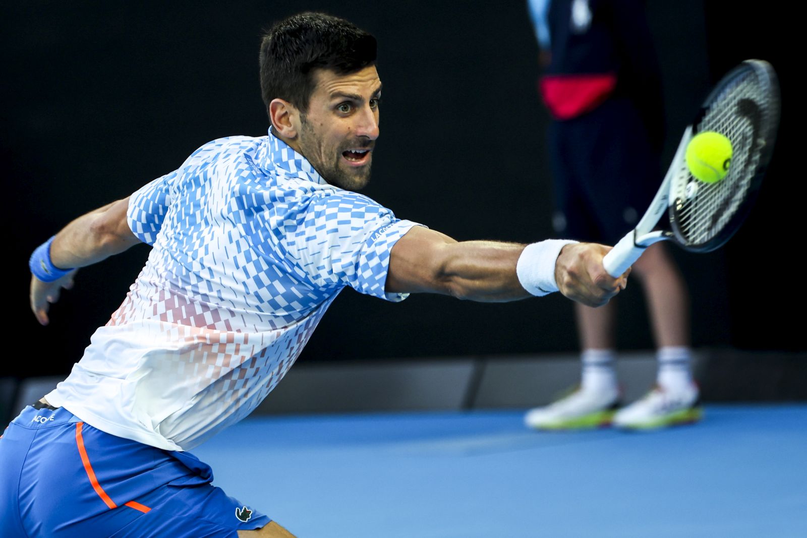 epa10428091 Novak Djokovic of Serbia in action against Andrey Rublev of Russia during their quarter final match at the Australian Open tennis tournament in Melbourne, Australia 25 January 2023.  EPA/FAZRY ISMAIL