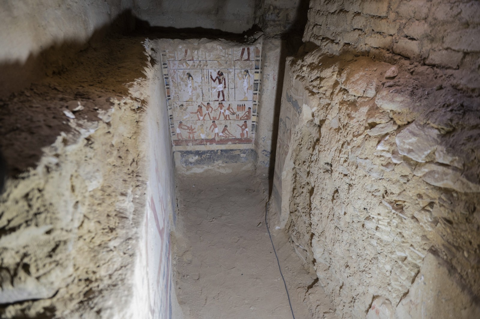 epa10431029 A general view inside a tomb after the announcement of the new discoveries in Gisr el-Mudir in Saqqara, Giza, Egypt, in 26 January 2023. An Egyptian archaeological mission made a number of important archaeological discoveries dating to the fifth and sixth dynasties of the Old Kingdom. The announcement stated that the expedition had found a group of Old Kingdom tombs, indicating that the site comprised a large cemetery. The most important tomb belonged to Khnumdjedef, an inspector of the officials, a supervisor of the nobles, and a priest in the pyramid complex of Unas, the last king of the fifth dynasty. The tomb is decorated with scenes of daily life.  EPA/Mohamed Hossam ElDin