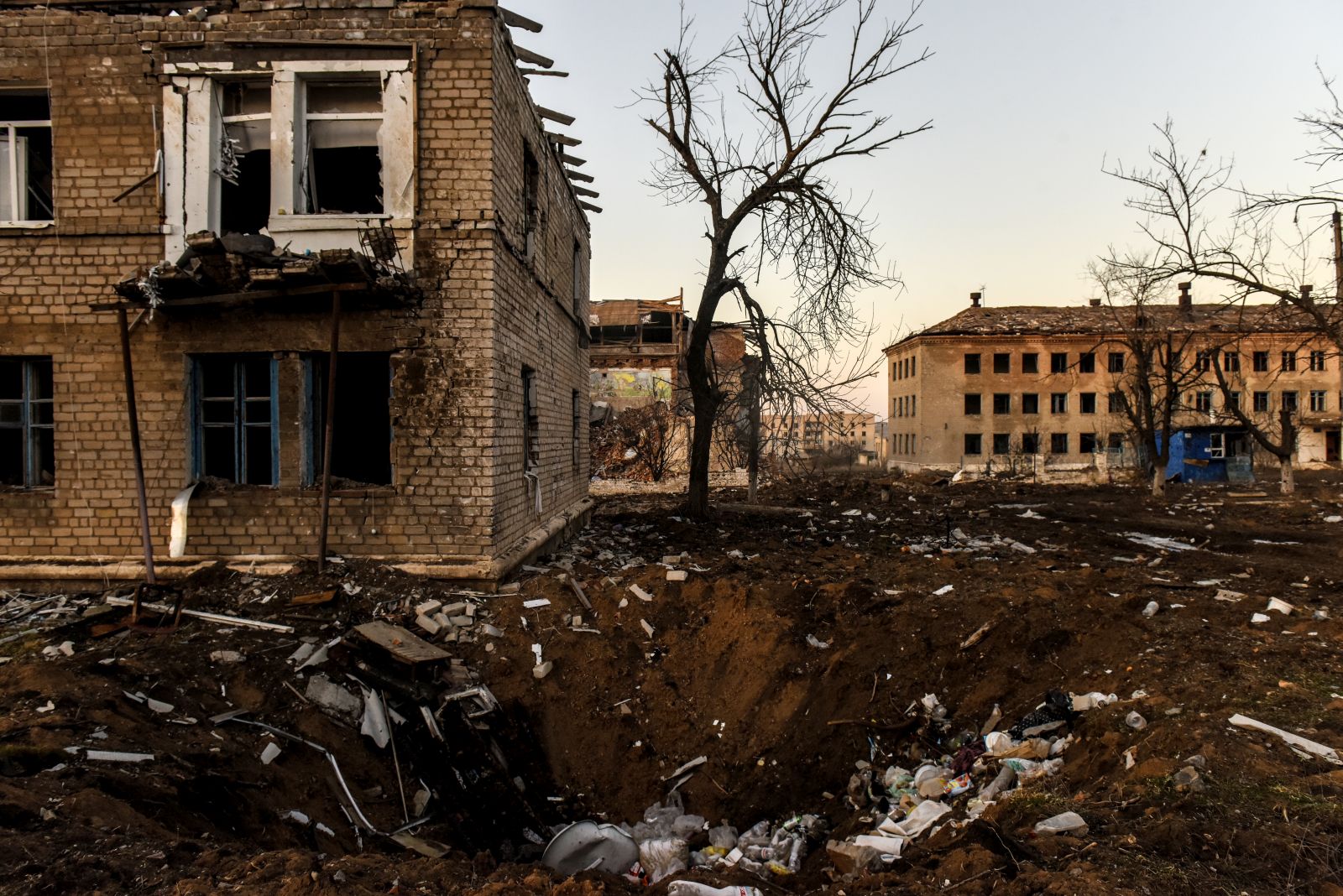 epa10434320 A shelling crater in Siversk, Donetsk region, eastern Ukraine, 27 January 2023. Ukrainian authorities ask people to evacuate from the frontline territories as there is no working infrastructure such as electricity, heating, water or gas left. Those who remain mostly spend their time in shelters, basements of residential buildings, due to the risk to die in Russian shelling. Russian troops entered Ukraine teritory on 24 February 2022, starting an armed conflict that has provoked destruction and a humanitarian crisis.  EPA/OLEG PETRASYUK