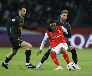 Soccer Football - Ligue 1 - Paris St Germain v Stade de Reims - Parc des Princes, Paris, France - January 29, 2023 Stade de Reims' Folarin Balogun in action with Paris St Germain's Fabian Ruiz and Sergio Ramos REUTERS/Christian Hartmann Photo: CHRISTIAN HARTMANN/REUTERS