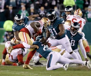 epa10439443 San Francisco 49ers wide receiver Deebo Samuel #19 (C) is tackled down by the Philadelphia Eagles in the second half during the NFC Championship NFL football game between the Philadelphia Eagles and the San Francisco 49ers at Lincoln Financial Field in Philadelphia, Pennsylvania, USA, 29 January 2023. The winner will go on to face either the Kansas City Chiefs or the Cincinnati Bengals in Super Bowl LVII on 12 February, 2023 in Glendale, Arizona.  EPA/JASON SZENES
