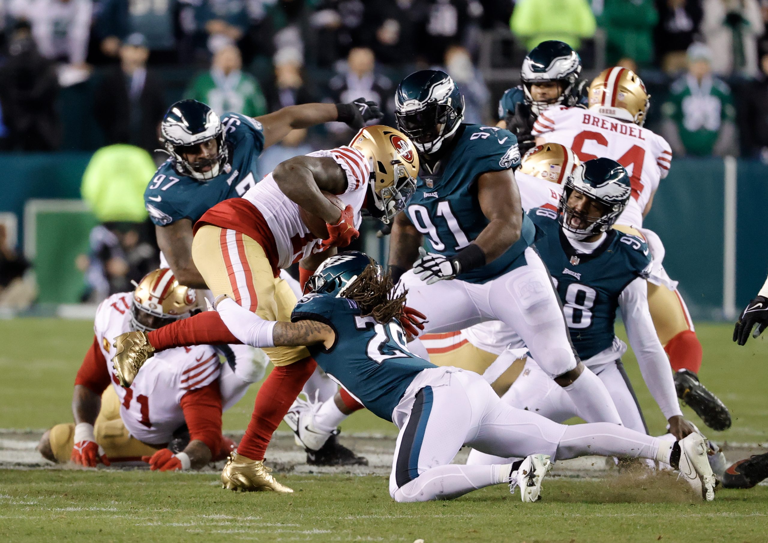 epa10439443 San Francisco 49ers wide receiver Deebo Samuel #19 (C) is tackled down by the Philadelphia Eagles in the second half during the NFC Championship NFL football game between the Philadelphia Eagles and the San Francisco 49ers at Lincoln Financial Field in Philadelphia, Pennsylvania, USA, 29 January 2023. The winner will go on to face either the Kansas City Chiefs or the Cincinnati Bengals in Super Bowl LVII on 12 February, 2023 in Glendale, Arizona.  EPA/JASON SZENES