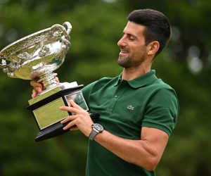 epa10439537 Novak Djokovic of Serbia poses with the Norman Brooks Challenge Cup following his win in the men's singles final in the 2023 Australian Open tennis tournament, at Government House in Melbourne, Australia, 30 January 2023.  EPA/JAMES ROSS  EDITORIAL USE ONLY AUSTRALIA AND NEW ZEALAND OUT