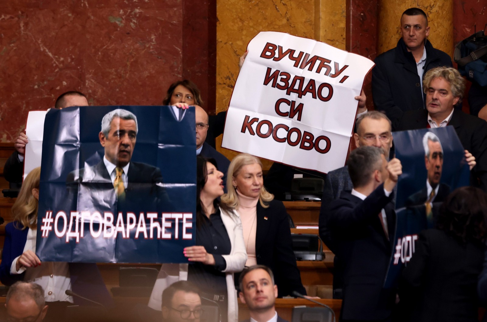 epa10443948 Members of the Serbian Parliament hold up a banner reading 'Vucic, you betrayed Kosovo' during a special session in Belgrade, Serbia, 02 February 2023. Serbia's Parliament convened for a special session so its members could be informed by the president and government officials on the ongoing negotiating process between Belgrade and Pristina.  EPA/ANDREJ CUKIC