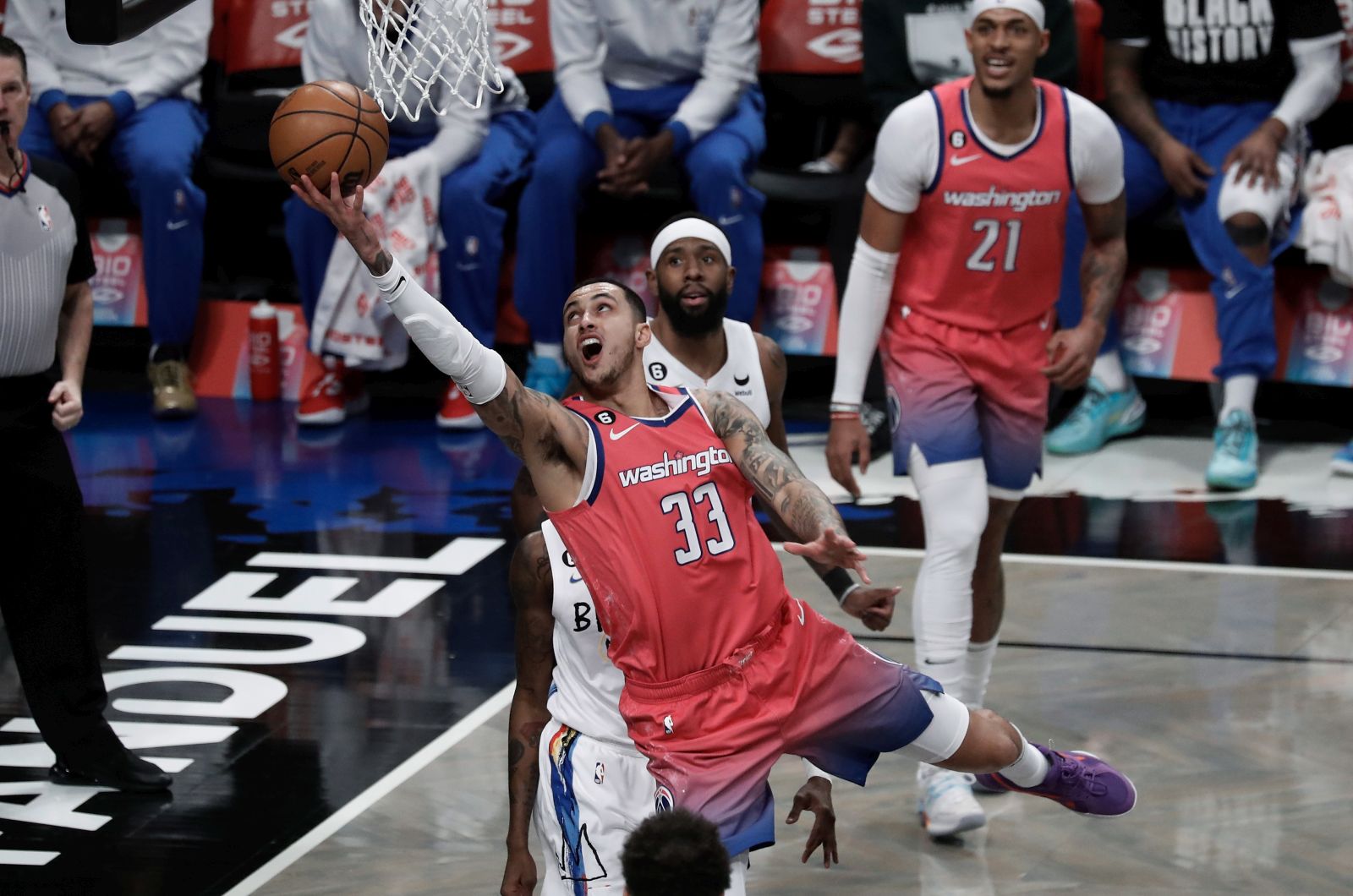 epa10448172 Washington Wizards forward Kyle Kuzma (C) shoots over Brooklyn Nets defenders during the first half of the NBA basketball game between the Washington Wizards and Brooklyn Nets at the Barclays Center in Brooklyn, New York, USA, 04 February 2023.  EPA/Peter Foley SHUTTERSTOCK OUT