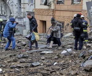 epa10448646 Locals evacuate from a damaged residential building following a missile strike, in Kharkiv, northeastern Ukraine, 05 February 2023, amid Russia's invasion. At least four people were injured after two Russian missiles hit downtown Kharkiv on 05 February, the head of the Kharkiv regional military administration, Oleg Sinegubov wrote on telegram. Kharkiv and surrounding areas have been the target of heavy shelling since February 2022, when Russian troops entered Ukraine starting a conflict that has provoked destruction and a humanitarian crisis.  EPA/SERGEY KOZLOV