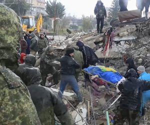 epa10452104 A still image taken from a handout video provided by the Russian Defence Ministry Press-Service on 07 February 2023 shows Syrian and Russian servicemen helping locals carrying the body of a victim found at the site of a collapsed building after a major earthquake in Latakia, Syria. More than 4,000 people were killed and thousands more injured after a major 7.8 magnitude earthquake struck southern Turkey and northern Syria on 06 February. Authorities fear the death toll will keep climbing as rescuers look for survivors across the region.  EPA/RUSSIAN DEFENCE MINISTRY PRESS SERVICE HANDOUT -- BEST QUALITY AVAILABLE -- MANDATORY CREDIT -- HANDOUT EDITORIAL USE ONLY/NO SALES