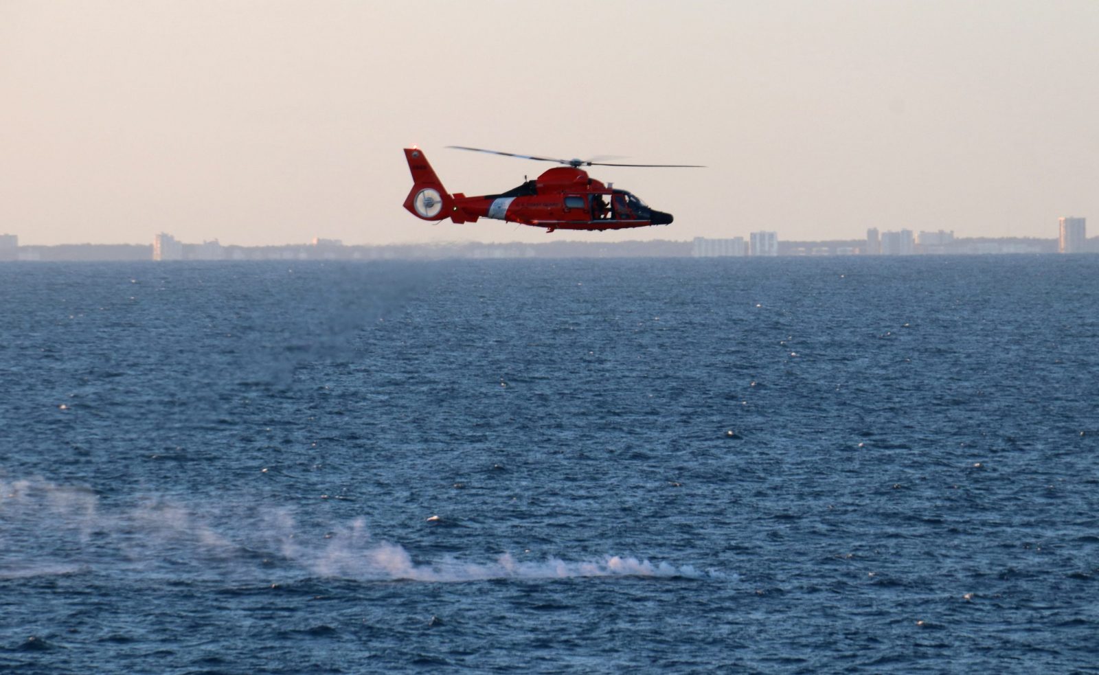 epa10453054 A handout photo made available by the US Central Command (CENTCOM) Public Affairs via the Defense Visual Information Distribution Service (DVIDS) on 07 February 2023 shows a U.S. Coast Guard helicopter flying over a debris field during recovery efforts of a high-altitude surveillance balloon off the coast of Myrtle Beach, South Carolina, 04 February 2023 (issued 07 February 2023). At the direction of the US President and with the full support of Canada's Government, U.S. fighter aircrafts under U.S. Northern Command authority engaged and brought down a high altitude surveillance balloon within sovereign U.S. airspace and over U.S. territorial waters 04 February 2023, according to the US Navy.  EPA/US Navy/Lt. j.g. Jerry Ireland / HANDOUT  HANDOUT EDITORIAL USE ONLY/NO SALES