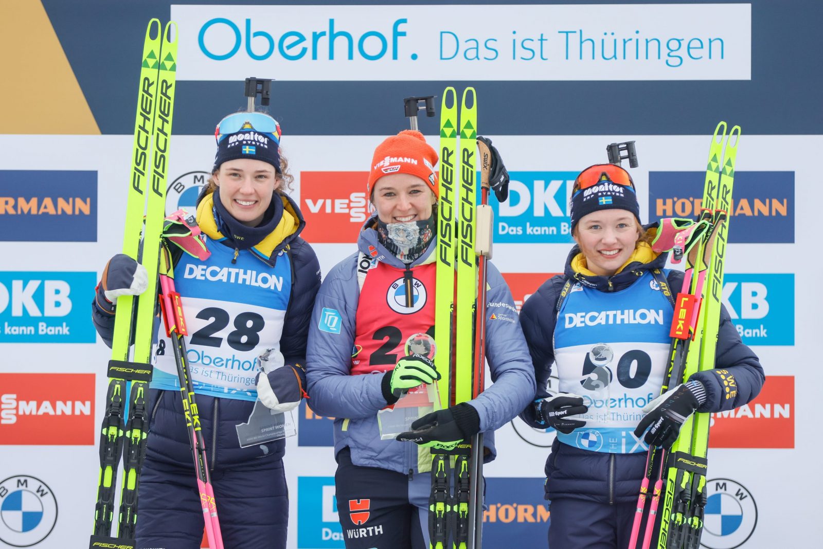 epa10459269 (L-R) Second placed Hanna Oeberg of Sweden, first placed Denise Herrmann-Wick of Germany and third placed Linn Persson of Sweden celebrate on the podium after the Women's 7.5km Sprint race at the IBU Biathlon World Championships in Oberhof, Germany, 10 February 2023.  EPA/RONALD WITTEK