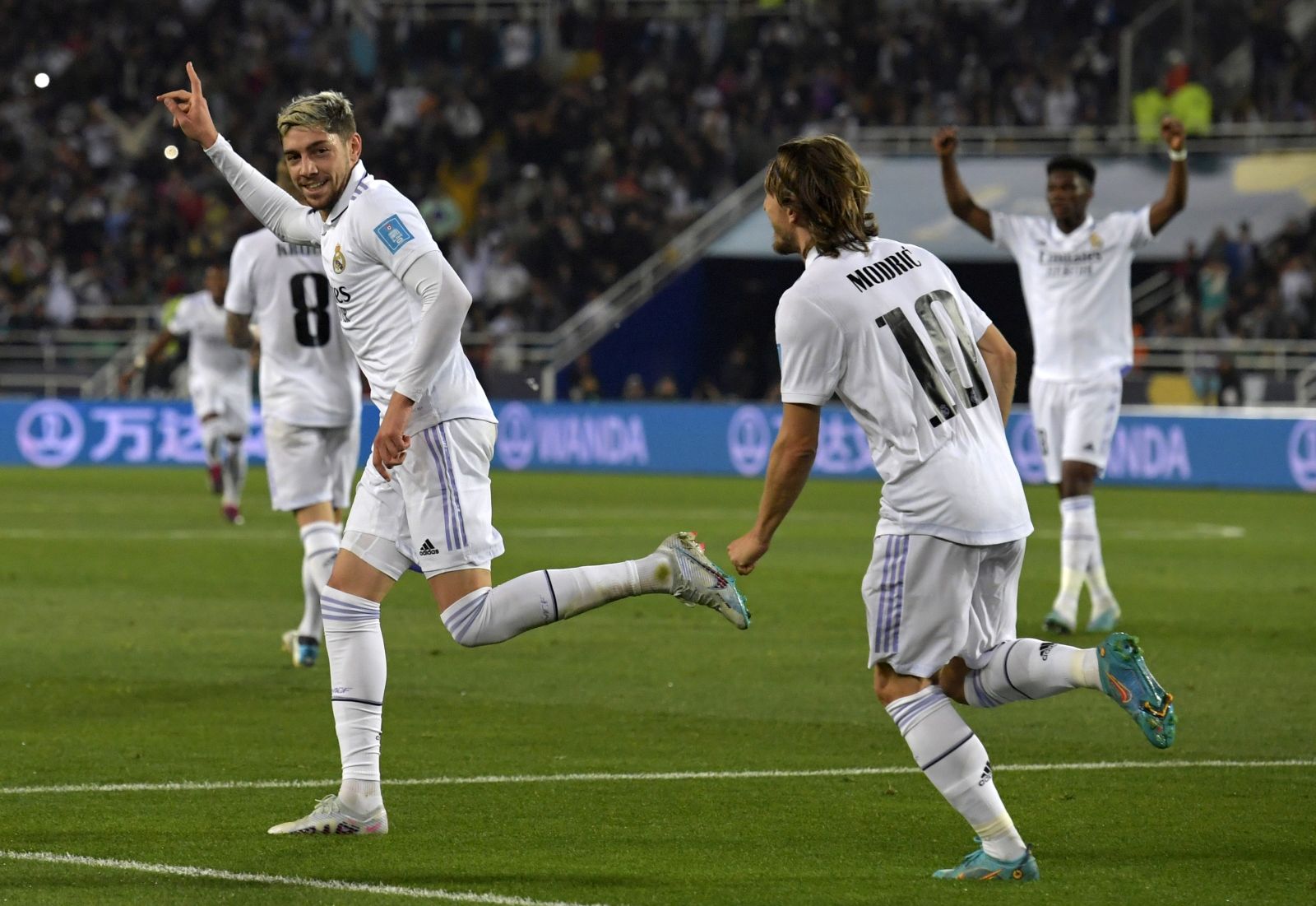 epa10461688 Real Madrid's Federico Valverde celebrates with teammates after scoring the 2-0 goal during the FIFA Club World Cup final between Real Madrid and Al Hilal SFC in Rabat, Morocco, 11 February 2023.  EPA/Jalal Morchidi