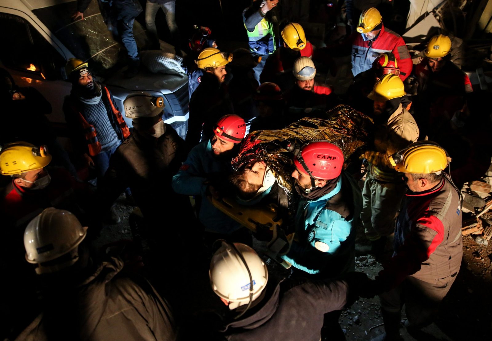 epa10462657 Members of a rescue team carry an earthquake survivor who was tarpped for more than 100 hours under the rubble of a collapsed building, in Hatay, Southern Turkey, 12 February 2023. More than 25,000 people have died and thousands more are injured after two major earthquakes struck southern Turkey and northern Syria on 06 February. Authorities expect the death toll will keep climbing as time passes, but the rescuers look for survivors across the region.  EPA/STR