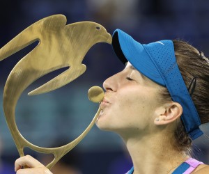 epa10463400 Belinda Bencic of Switzerland celebrates with the trophy after winning her final match against Liudmila Samsonova of Russia at WTA Abu Dhabi Open in Abu Dhabi, United Arab Emirates, 12 February 2023.  EPA/ALI HAIDER