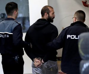epa10464605 Former professional kickboxer and social media influencer Andrew Tate (C) is escorted by police officers to the Directorate for Investigating Organized Crime and Terrorism (DIICOT) headquarters to be questioned in Bucharest, Romania, 13 February 2023. On 29 December 2022, Andrew Tate and his brother Tristan were arrested as a result of the DIICOT inquiry under the charges of human trafficking and intention to form an organized crime group. Romanian police stated that the two brothers and their associates coerced victims for creating a paid pornography service for social media platforms.  EPA/ROBERT GHEMENT