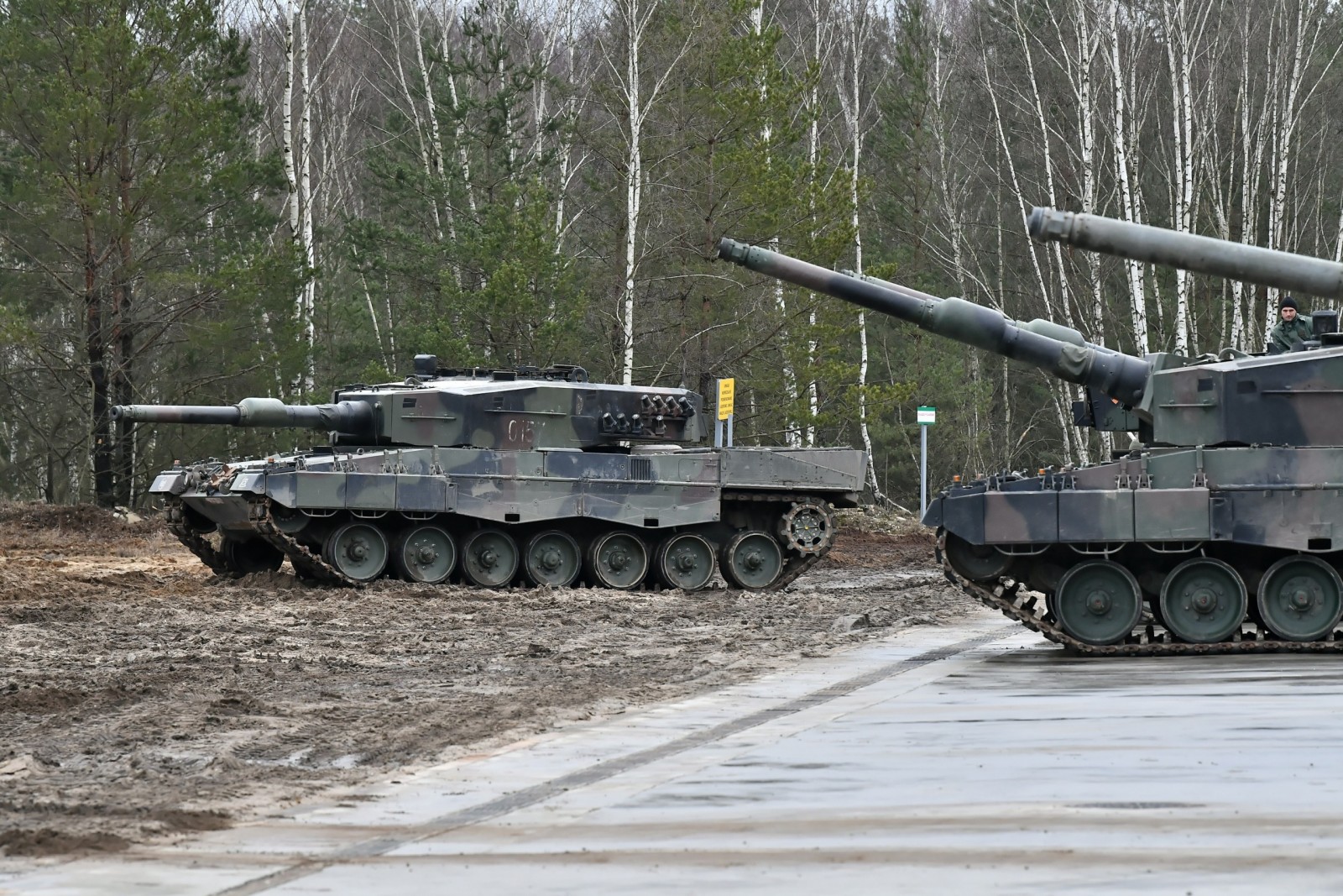 epa10465034 Leopard tanks are parked at a training site in Swietoszow, west Poland, 13 February 2023. The 10th Armored Cavalry Brigade, part of the 11th Armored Cavalry Division, is training personnel of the Armed Forces of Ukraine within the framework of the European Union Military Assistance Mission Ukraine (EUMAM Ukraine). The training includes, among other things, the training of crews of Leopard tanks, transferred to Ukraine.  EPA/Maciej Kulczynski POLAND OUT