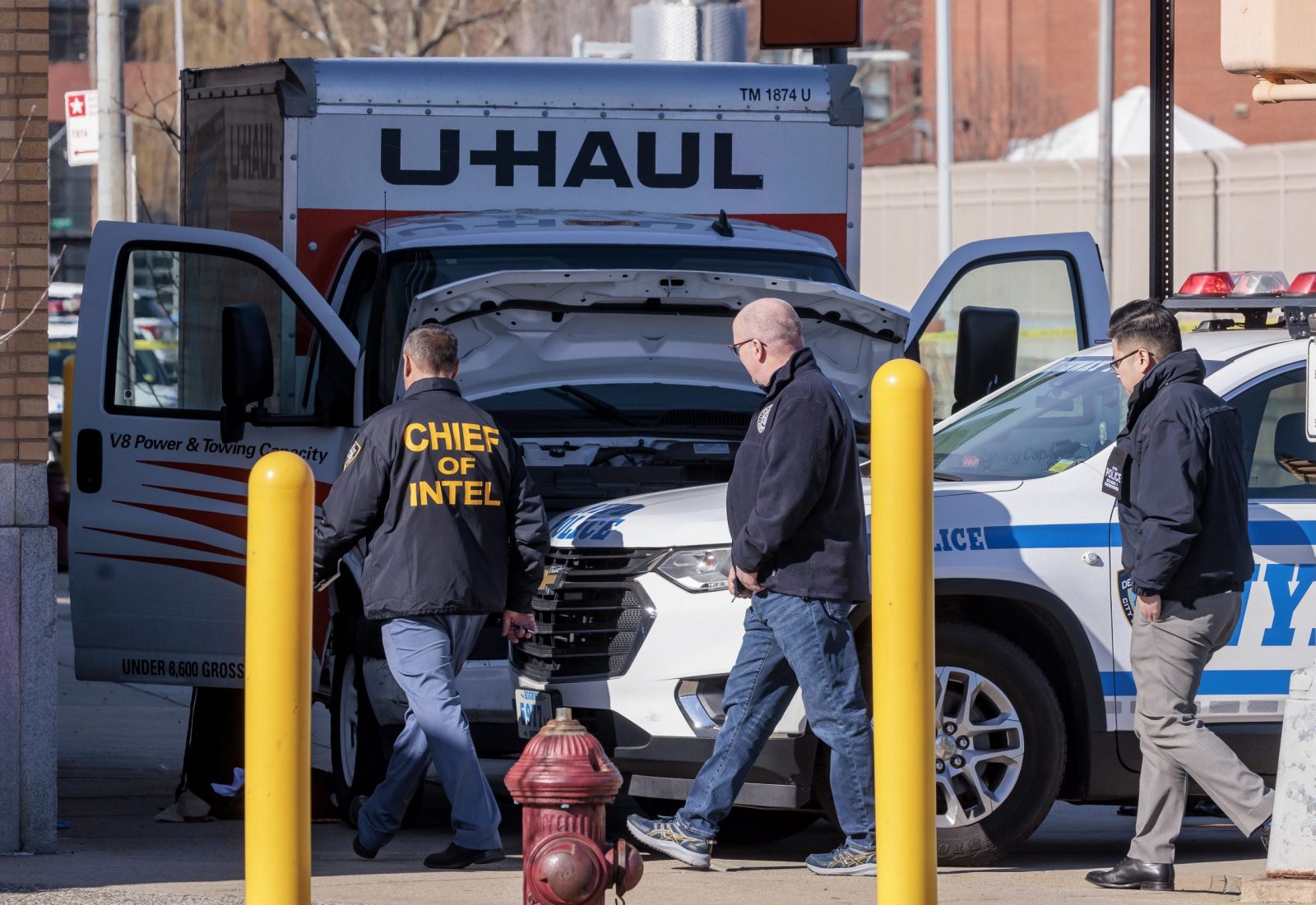 epa10465503 New York City police officers on the scene where a U-haul moving truck was stopped after running over multiple pedestrians in the Brooklyn borough of New York, New York, USA, 13 February 2023. Police are still investigating the reason for the driver’s actions which left multiple injured in a number of different locations, though police said there was not any early indication of a terrorism connection.  EPA/JUSTIN LANE