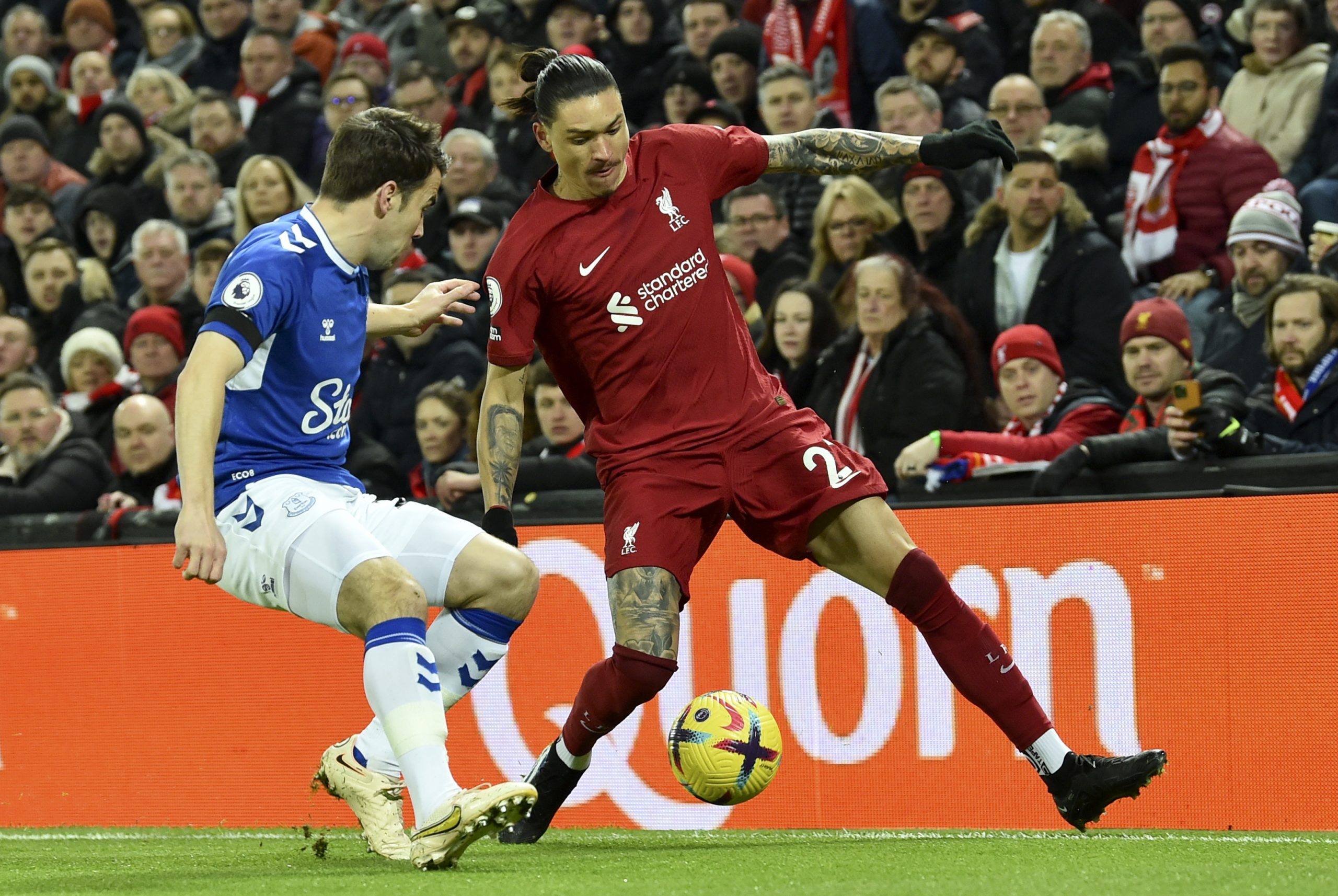epa10465621 Darwin Nunez (R) of Liverpool in action against Seamus Coleman (L) of Everton during the English Premier League soccer match between Liverpool FC and Everton FC in Liverpool, Britain, 13 February 2023.  EPA/PETER POWELL EDITORIAL USE ONLY. No use with unauthorized audio, video, data, fixture lists, club/league logos or 'live' services. Online in-match use limited to 120 images, no video emulation. No use in betting, games or single club/league/player publications