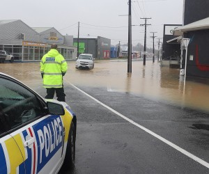 epa10465753 A handout photo made available by the New Zealand Police assisting motorists around flood waters in Whangārei, New Zealand, issued 13 February 2023. The New Zealand government is considering a national state of emergency, with tens of thousands of homes without power and Cyclone Gabrielle's worst still to come as the storm surges south.  EPA/NEW ZEALAND POLICE HANDOUT AUSTRALIA AND NEW ZEALAND OUT HANDOUT EDITORIAL USE ONLY/NO SALES/NO ARCHIVES