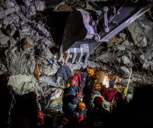 epa10465949 Rescuers work at the site of collapsed buildings after a powerful earthquake, in Hatay, Turkey, 13 February 2023. More than 35,000 people have died and thousands more are injured after two major earthquakes struck southern Turkey and northern Syria on 06 February. Authorities fear the death toll will keep climbing as rescuers look for survivors across the region.  EPA/MARTIN DIVISEK
