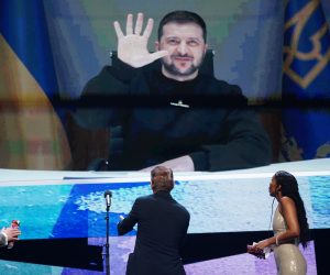 epa10471407 Ukraine's President Volodymyr Zelensky appears on screen at the Opening Ceremony of the 73rd Berlin International Film Festival 'Berlinale' in Berlin, Germany, 16 February 2023. The in-person event runs from 16 to 26 February 2023.  EPA/CLEMENS BILAN