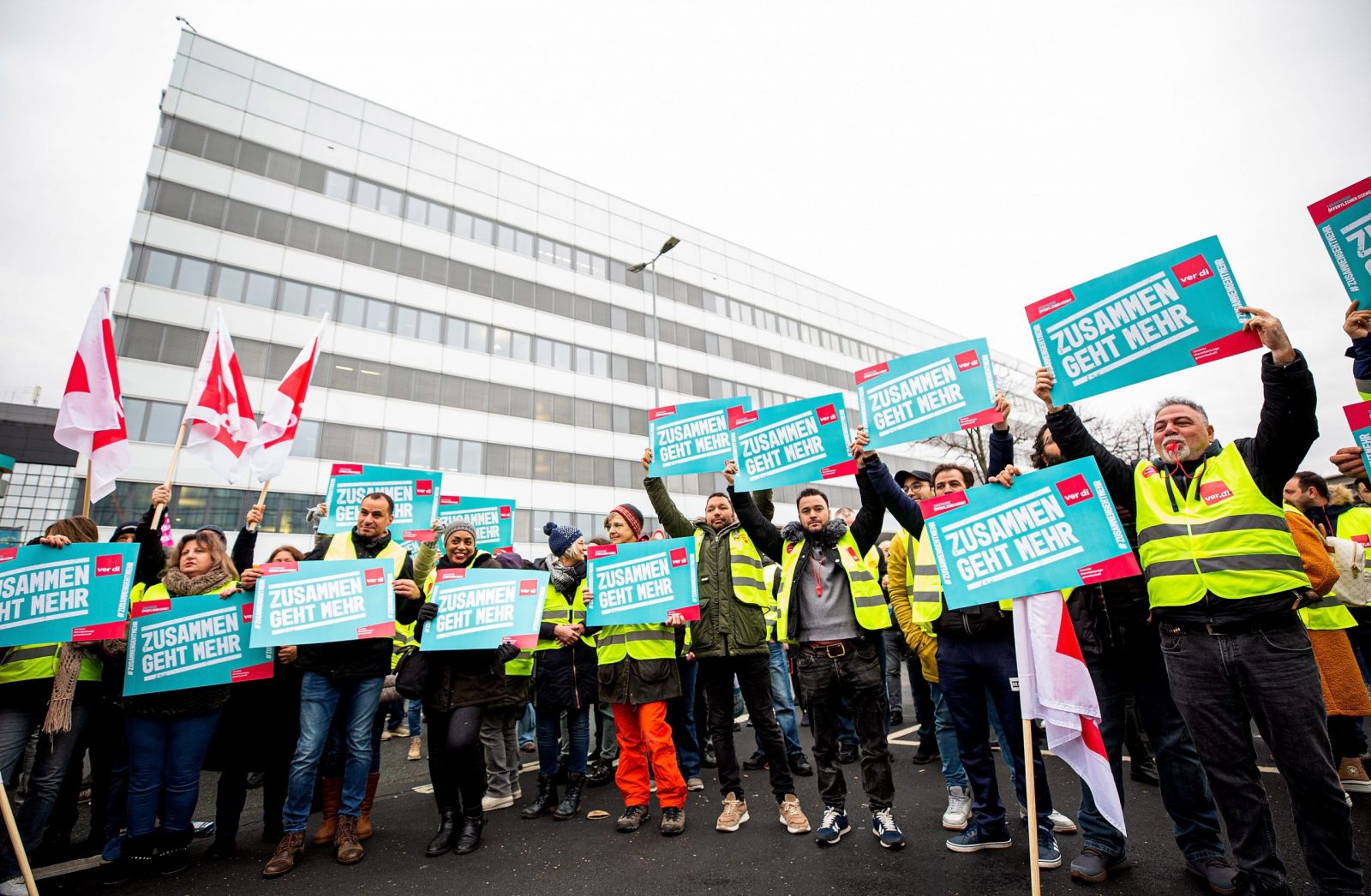 epa10472434 Sttriking workers demonstrate outside of the Frankfurt International Airport in Frankfurt am Main, Germany, 17 February 2023. Following the strike announcement by the trade union ver.di, the operators of the airports in Frankfurt, Munich and Hamburg have announced that they will cease regular operations on Friday 17 February. All take-offs and landings of passenger flights and commercial connections are likely to be cancelled. According to the airport association ADV, the warning strike will lead to a good 2340 flight cancellations and could thus affect around 295.000 passengers.  EPA/HOSAM KATAN