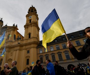 epa10475078 A woman holds Ukraine's flag during a rally supporting Ukraine during the 59th Munich Security Conference (MSC) in Munich, Germany, 18 February 2023. More than 500 high-level international decision-makers meet at the 59th Munich Security Conference in Munich during their annual meeting from 17 to 19 February 2023 to discuss global security issues.  EPA/ANNA SZILAGYI