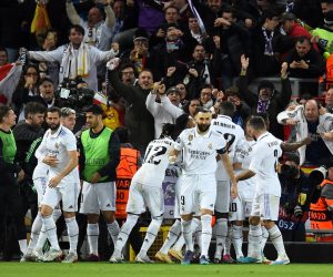 epa10482585 Players of Real Madrid celebrate after scoring their third goal during the UEFA Champions League, Round of 16, 1st leg match between Liverpool FC and Real Madrid in Liverpool, Britain, 21 February 2023.  EPA/Peter Powell