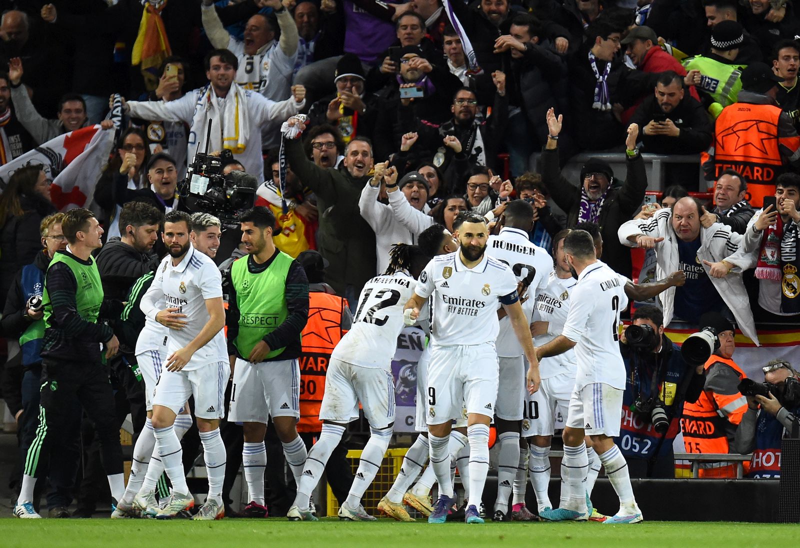 epa10482585 Players of Real Madrid celebrate after scoring their third goal during the UEFA Champions League, Round of 16, 1st leg match between Liverpool FC and Real Madrid in Liverpool, Britain, 21 February 2023.  EPA/Peter Powell