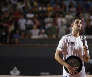 epa10484624 Thomaz Bellucci of Brazil speaks at the end of his final singles match as a professional against Sebastian Baez of Argentina, at the Rio Open tennis tournament in Rio de Janeiro, Brazil, 22 February 2023.  EPA/ANDRE COELHO
