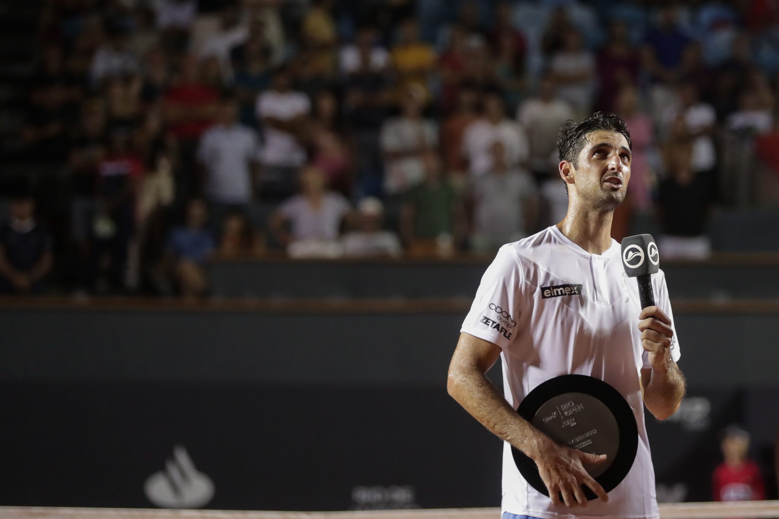 epa10484624 Thomaz Bellucci of Brazil speaks at the end of his final singles match as a professional against Sebastian Baez of Argentina, at the Rio Open tennis tournament in Rio de Janeiro, Brazil, 22 February 2023.  EPA/ANDRE COELHO