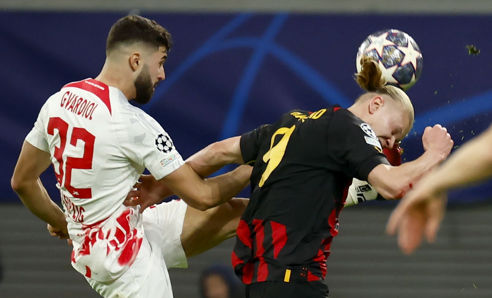 epa10484448 Josko Gvardiol
 (L) of Leipzig in action against Erling Haaland of Manchester City during the UEFA Champions League, Round of 16, 1st leg between RB Leipzig and Manchester City in Leipzig, Germany, 22 February 2023.  EPA/Hannibal Hanschke