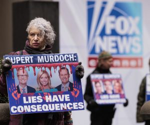 epa10495778 Sandy R., of New York, holds a sign while participating in a protest organized by the group Rise and Resist outside of Fox News headquarters in New York, New York, USA, 28 February 2023. A deposition which was recently made public from Dominion Voting Systems’ $1.6 billion defamation lawsuit against Fox shows Rupert Murdoch, the chairman company that owns Fox News, admitting that a number of the television station’s on air personalities promoted the false narrative that the 2020 presidential election was stolen from then President Donald Trump.  EPA/JUSTIN LANE