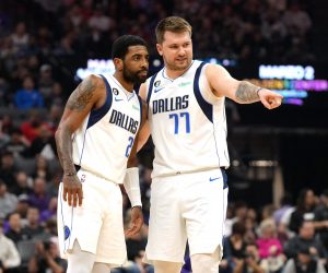 Feb 11, 2023; Sacramento, California, USA; Dallas Mavericks guard Kyrie Irving (2) and guard Luka Doncic (77) talk during the first quarter against the Sacramento Kings at Golden 1 Center. Mandatory Credit: Darren Yamashita-USA TODAY Sports Photo: Darren Yamashita/REUTERS
