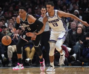 Feb 24, 2023; Los Angeles, California, USA; LA Clippers guard Russell Westbrook (0) and Sacramento Kings forward Keegan Murray (13) battle for the ball in the second half at Crypto.com Arena. The Kings defeated the Clippers 176-175 in double overtime. Mandatory Credit: Kirby Lee-USA TODAY Sports Photo: Kirby Lee/REUTERS