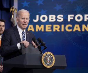 epa10445694 US President Joe Biden delivers remarks on employment figures and the economy in front of Brian Deese (Back), Assistant to the President & Director of the National Economic Council in the Eisenhower Executive Office Building on the White House complex in Washington, DC, USA, 03 February 2023.  EPA/MICHAEL REYNOLDS