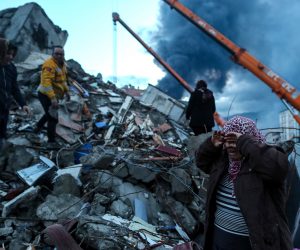 epa10452065 A woman reacts as emergency personnel carry out a search and rescue operation at the site of a collapsed building following an earthquake in Iskenderun, district of Hatay, Turkey, 07 February 2023. More than 4,000 people were killed and thousands more injured after a major 7.8 magnitude earthquake struck southern Turkey and northern Syria on 06 February. Authorities fear the death toll will keep climbing as rescuers look for survivors across the region.  EPA/ERDEM SAHIN