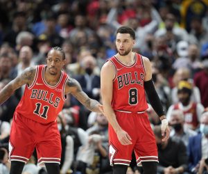 Chicago Bulls forward DeMar DeRozan (11) and Chicago Bulls guard Zach LaVine (8) in the second half of an NBA basketball game Friday, Nov. 19, 2021, in Denver. The Bulls won 114-108. (AP Photo/David Zalubowski)